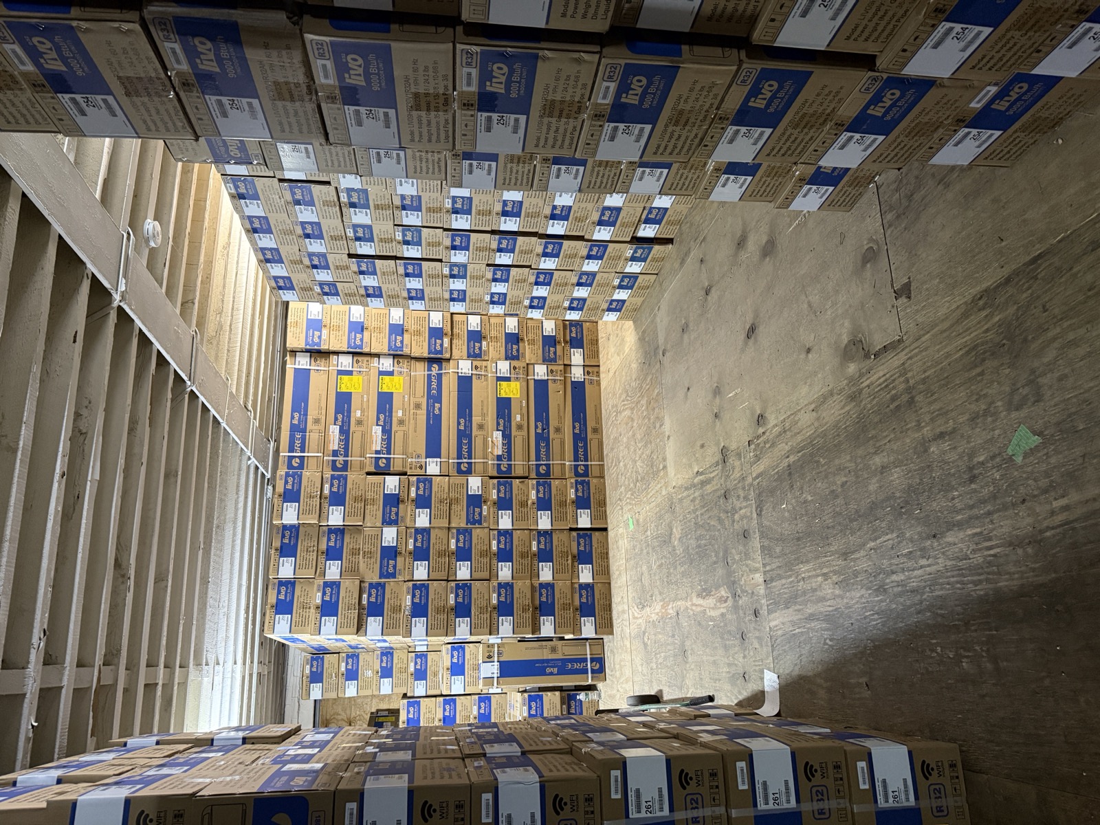 Stacks of Gree Livo split-type heat pump boxes at Kings AC Supply wholesale warehouse