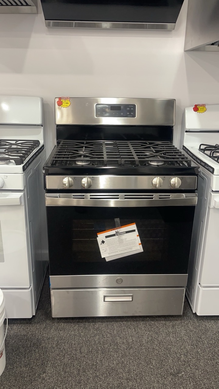GE stainless-steel five-burner gas range on display in the Kings AC Supply appliance showroom