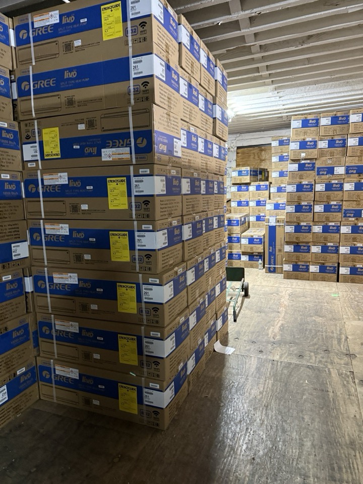 Pallets of Gree Livo split-type heat pump boxes ready for contractor pickup